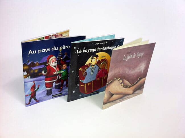 trois livres personnalisés avec illustrations enfantines colorées
